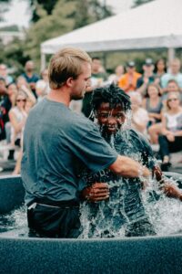 A joyful outdoor baptism ceremony capturing faith and community spirit in Clemson.